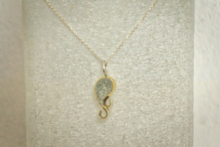 'Wave of the Whale' (crushed rock in brass) including Sterling silver necklace: R 590.00 (approx. EURO 40.00)